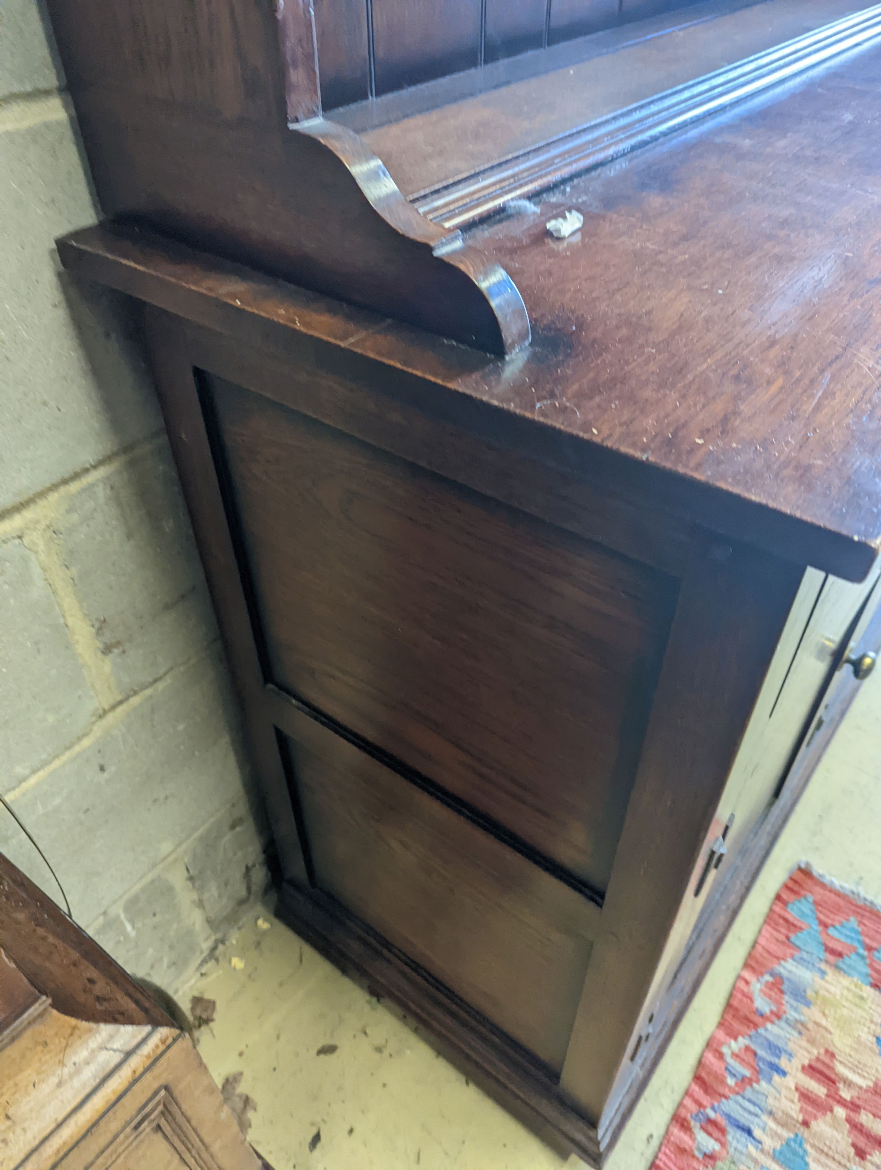 An 18th century style oak dresser with boarded plate rack, width 199cm, depth 48cm, height 198cm